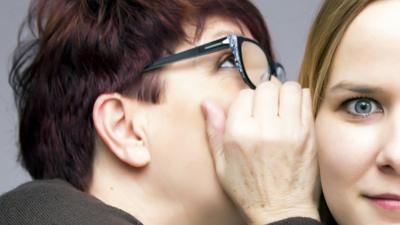 Two women gossiping