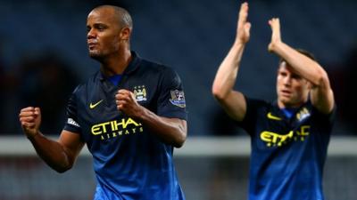 Manchester City players Vincent Kompany and James Milner celebrate after their 2-0 victory over Aston Villa