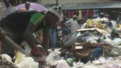 Man picking through rubbish