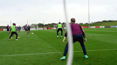 England and Liverpool midfielder, Jordan Henderson scores volley against England and Manchester City goalkeeper, Joe Hart in training