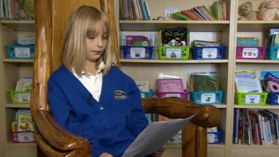 Maddy Snell reads a copy of the letter she sent to Prime Minister David Cameron