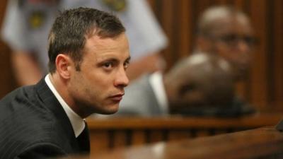 Oscar Pistorius sits in the dock in court in Pretoria