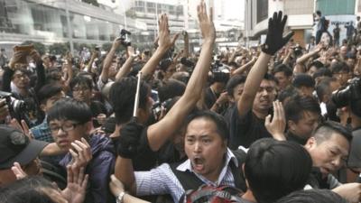 A Hong Kong police officer at clashes involving pro-democracy protesters from the Occupy Central movement and anti-occupy protesters in the Central District of Hong Kong