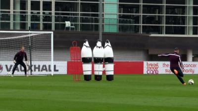 Wayne Rooney practises free kicks during England training