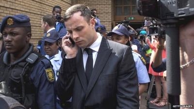 Oscar Pistorius leaves court on 13 October 2014