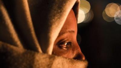 Woman at Holot detention centre with face covered