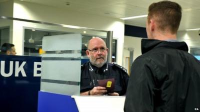 Photo issued by Public Health England of actor posing as a passenger being screened at Heathrow airport