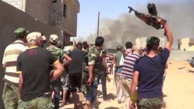 Militia group hold up weapons in Libya