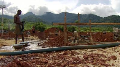 Workers on a construction site, building a hospital