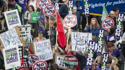 Demonstrators take part in the Britain Needs a Pay Rise march in London