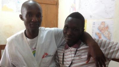 Alexander Kollie (l) and his son James pictured after his recovery