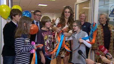 Liz Hurley opening Care in the High Street