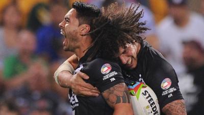 New Zealand's Shaun Johnson (l) celebrates scoring a try with Kevin Proctor