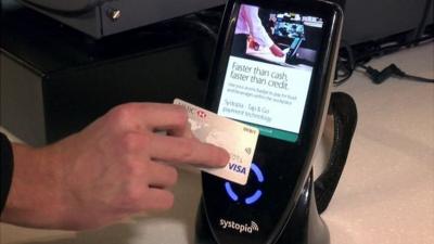 hand using contactless card