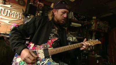 Man playing guitar in Kentucky