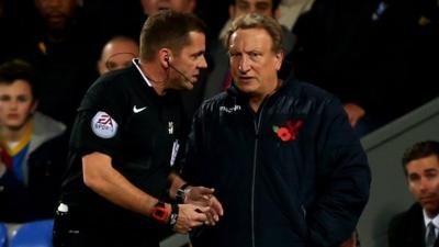 Crystal Palace manager Neil Warnock (r) and referee Phil Dowd