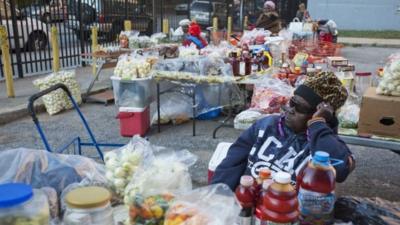 Women selling food at Liberian market in Clifton neighbourhood of Staten Island