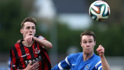 Match action from Ballinamallard against Crusaders