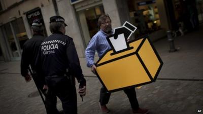 Man carrying picture of ballot box