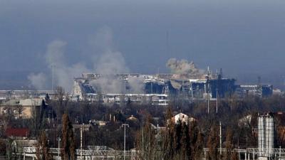 Smoke rises above a new terminal of the Sergey Prokofiev International Airport after shelling during fighting between pro-Russian separatists and Ukrainian government forces in Donetsk