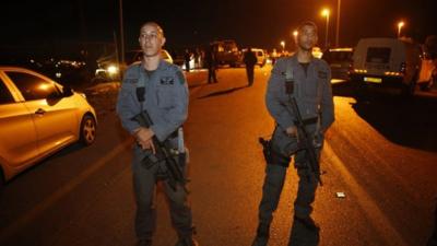 Israeli police officers stand guard at the scene of a stabbing attack near the West Bank Jewish settlement of Alon Shvut