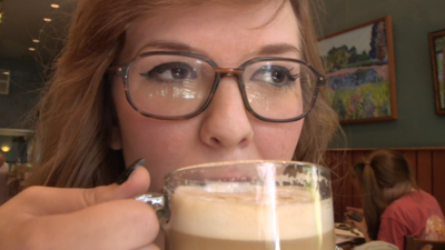 Woman sipping coffee