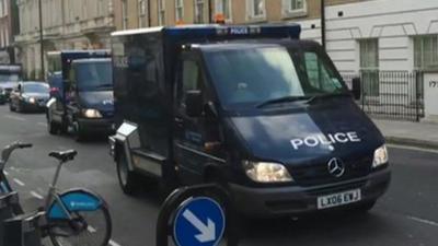 Police vans outside Westminster Magistrates Court