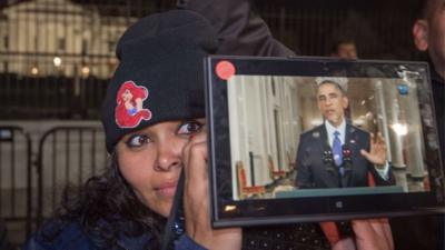 Woman watching Obama's speech live