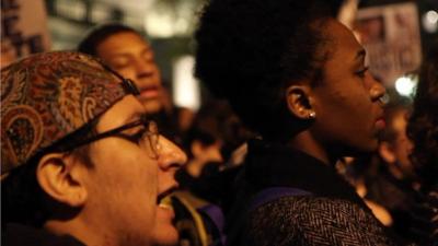 Close up of faces of New York protesters following grand jury decision not to indict officer who shot Michael Brown