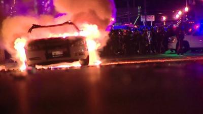 Rioters set fire to cars