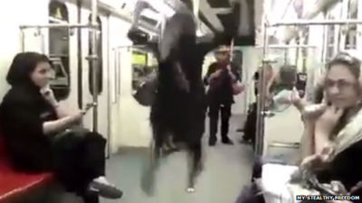 Woman dancing on Tehran Metro