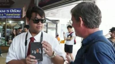 Activist with his copy of 1984