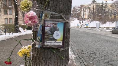 poster and flowers on tree