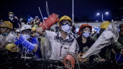 Protesters shout at police