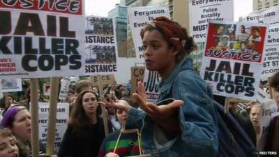 Girl addressing protesters at pro-Ferguson rally in New York City