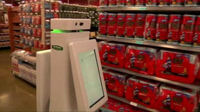 Retail robot moving across shop floor