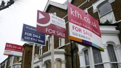 For Sale signs outside houses