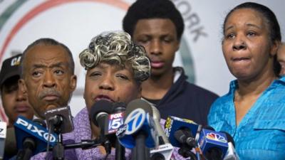 Eric Garner's mother Gwen Carr (centre front) and widow Esaw Garner (right)