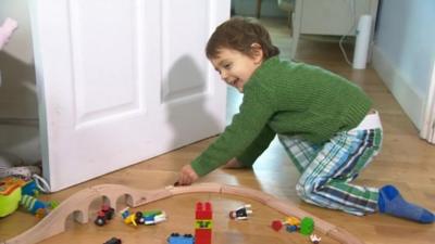 Boy with train set