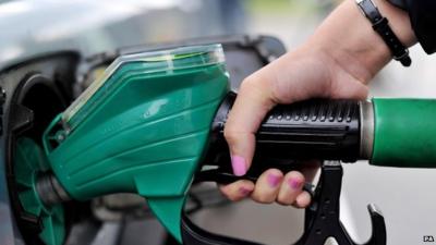 Hand filling car with petrol