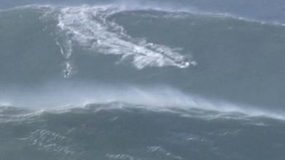 Surfer riding a big wave