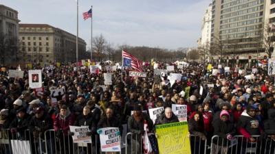 Protesters gather on Freedom Plaza for the march through Washington DC, 13 December