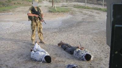 British soldier with Iraqi detainees