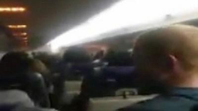 Billy Pollock's video shows passengers on board the flight applauded as the plane made its emergency landing