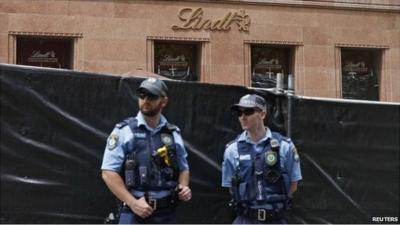 The Lindt Chocolat Cafe is cordoned off while police investigate the crime scene