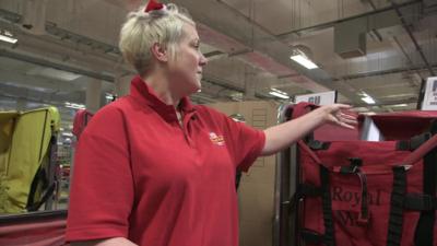 Postal worker with Santa hat