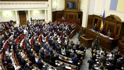 Parliamentary deputies applaud after a renouncing of Ukraine's "non-aligned" status during a session of a parliament in Kiev