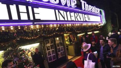 Fans line up at the Silent Movie Theatre for a midnight screening of "The Interview" in Los Angeles