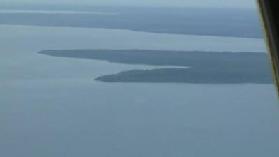 View of sea and land from Indonesian military plane search for AirAsia QZ8501