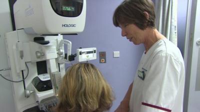 Medical worker giving patient scan for cancer